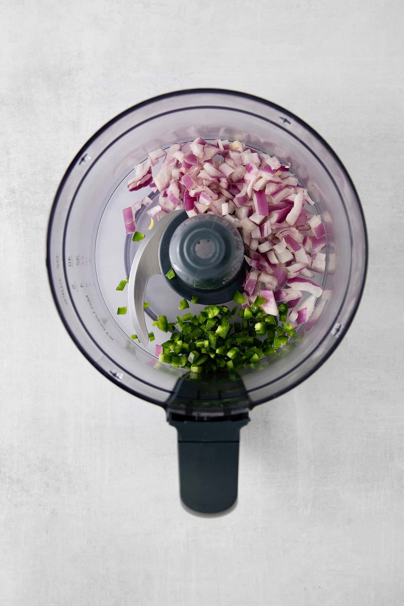 This Restaurant Style Salsa is a mild and easy salsa recipe made with fire-roasted tomatoes, jalapenos, cilantro, and Iime. Tomato and jalapeno in a food processor