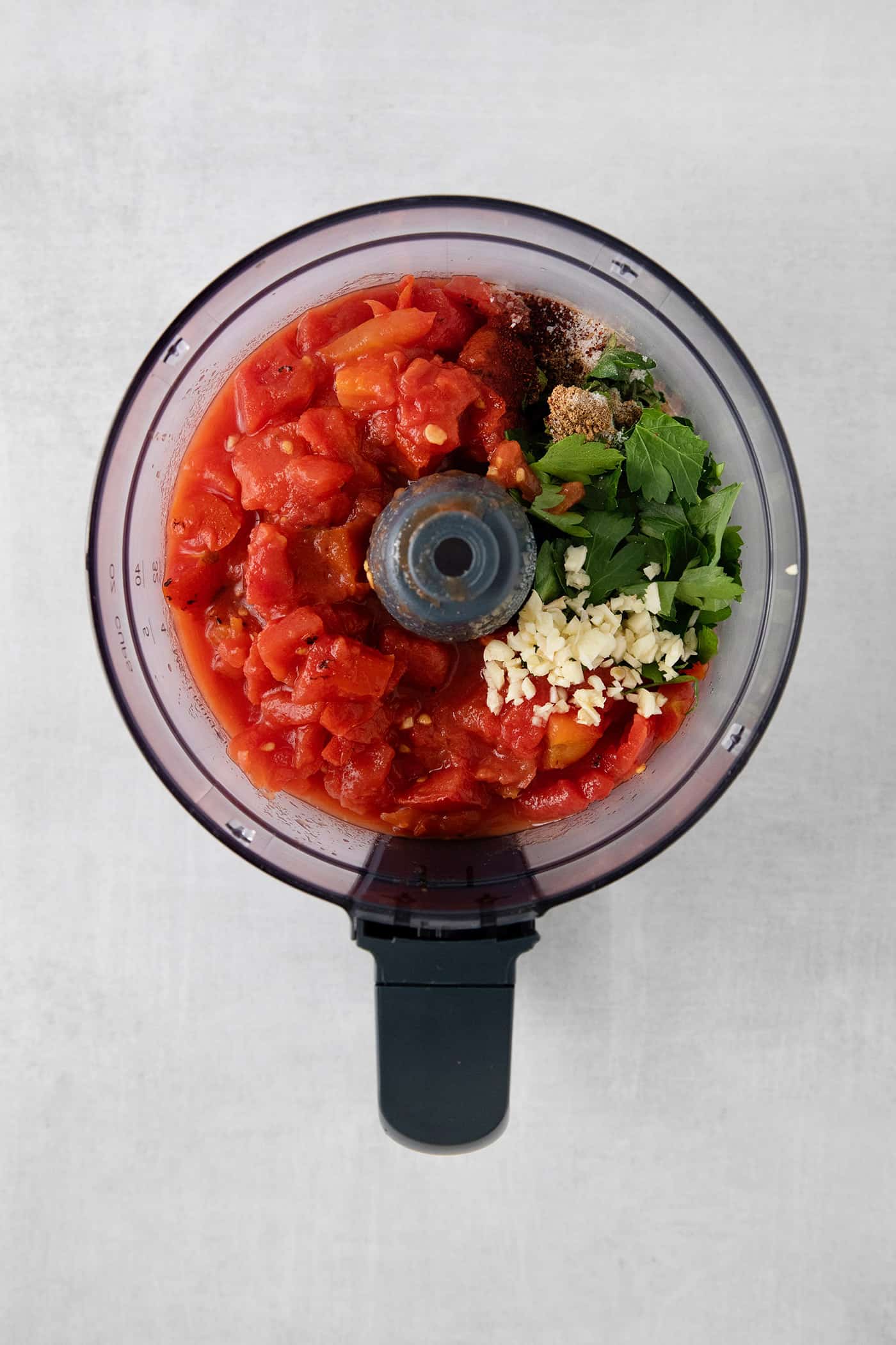 This Restaurant Style Salsa is a mild and easy salsa recipe made with fire-roasted tomatoes, jalapenos, cilantro, and Iime. Canned tomatoes, cilantr, jalapeno, garlic, and onion in a food processor