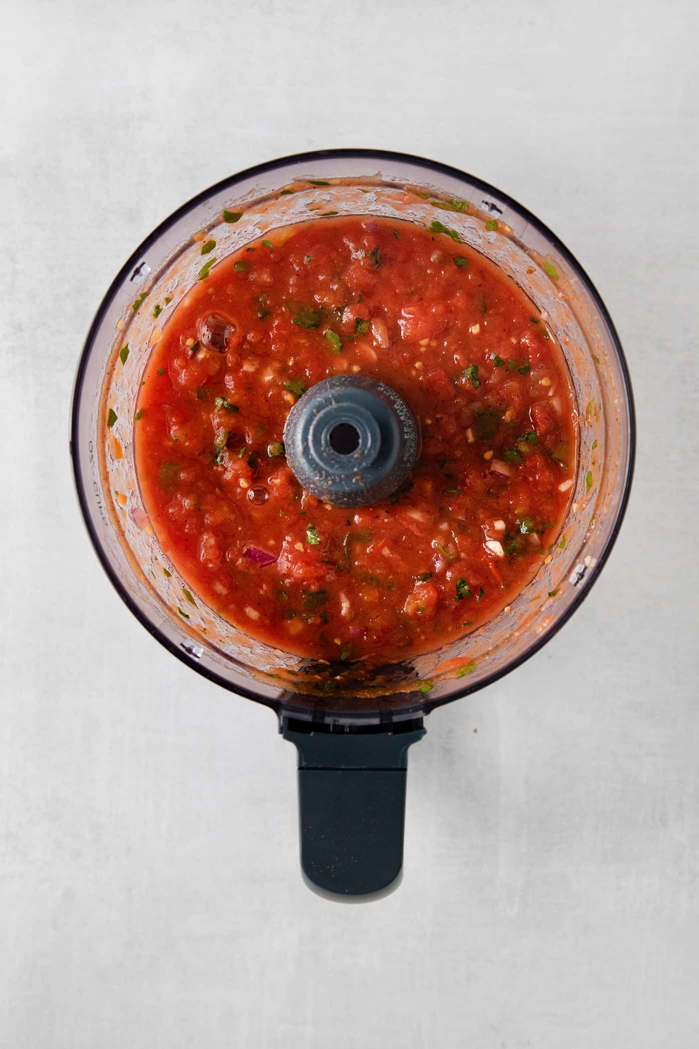 This Restaurant Style Salsa is a mild and easy salsa recipe made with fire-roasted tomatoes, jalapenos, cilantro, and Iime. Blender salsa in a food processor