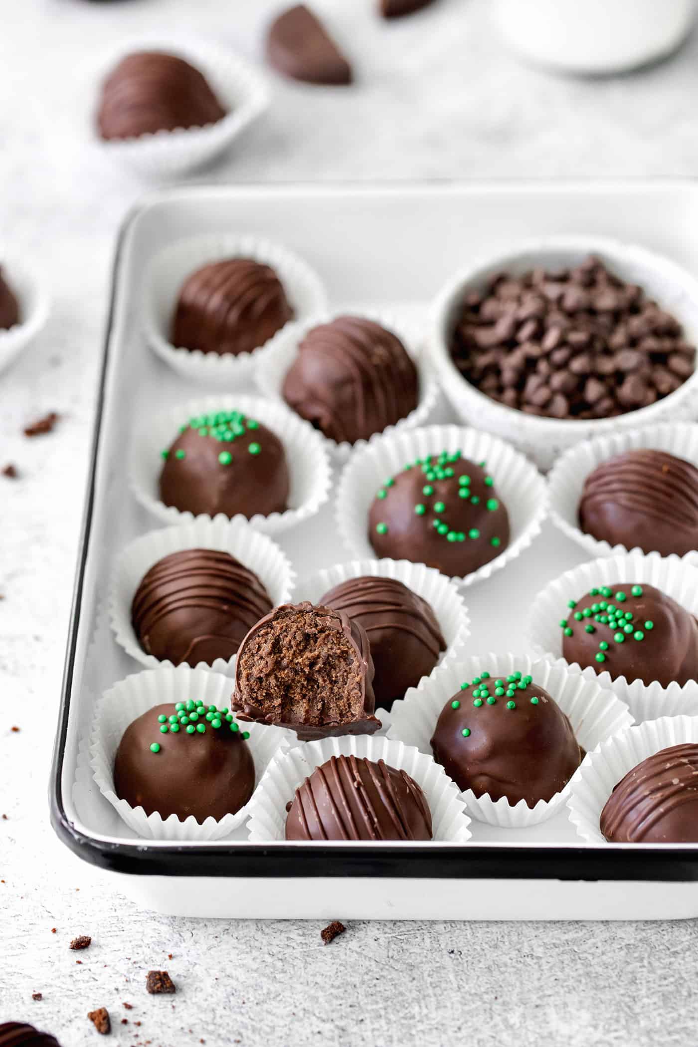 Made with your favorite Girl Scout cookies, these Thin Mint Truffles are the perfect combination of rich chocolate and mint flavor. Angled view of a tray of thin mint truffles