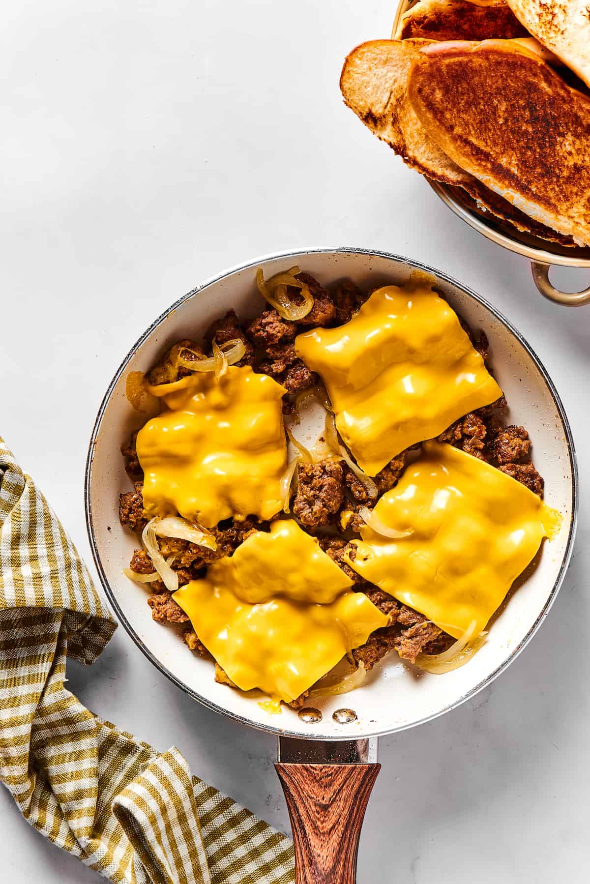 With ground beef, sauteed onions, and LOTS of cheese, it's easy to see why this Chopped Cheese Sandwich is always a hit! Crumbled ground beef topped with yellow American cheese