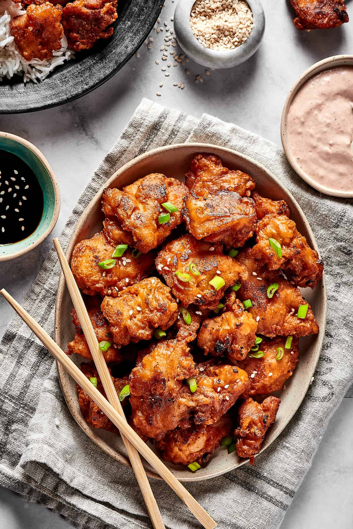 Mochiko Chicken is classic Hawaiian Fried Chicken, made with a mochiko flour batter that adds a unique, sweet flavor. Serve with rice. Overhead view of a platter of mochiko chicken