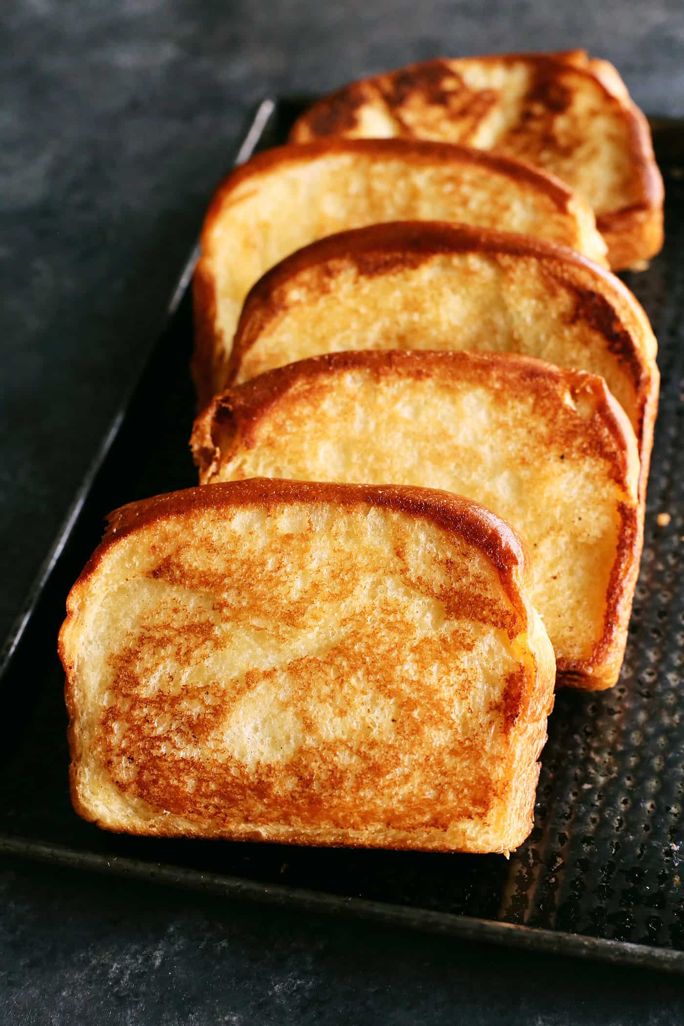 This Homemade Texas Toast Garlic Bread is made entirely on the stovetop with just 3 ingredients. It's the perfect addition to any meal. Slices of Texas toast layered over each other