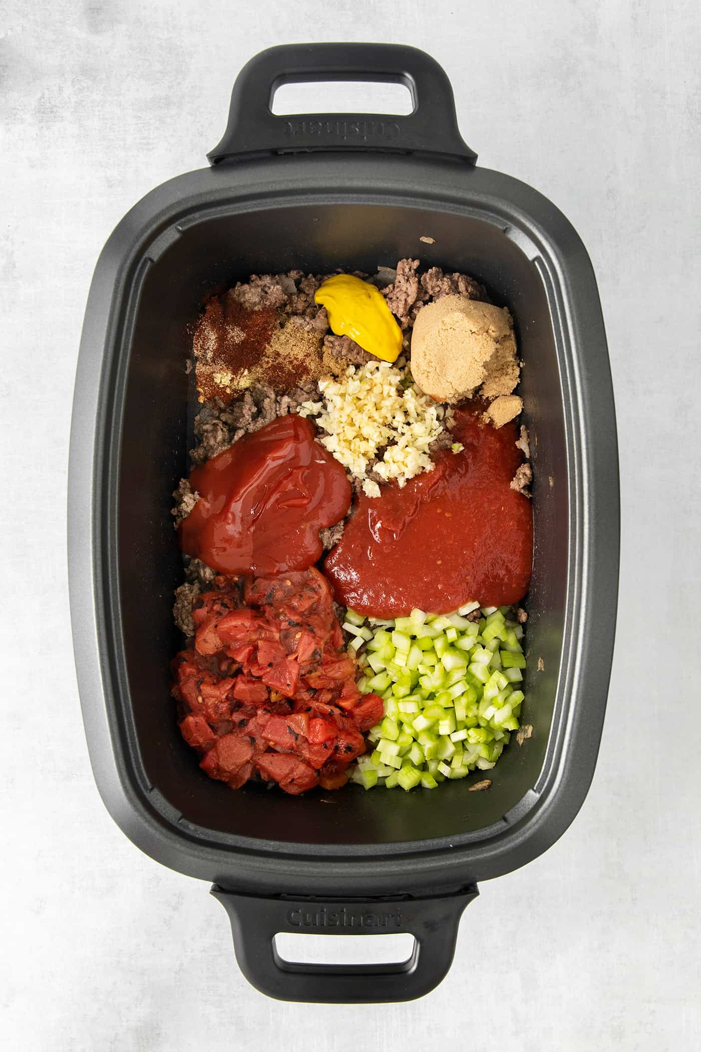 Slow Cooker Sloppy Joes are super flavorful, easy to make, and great for feeding a crowd. Serve on sandwich buns for a quick meal anytime. Sloppy joe ingredients in a slow cooker