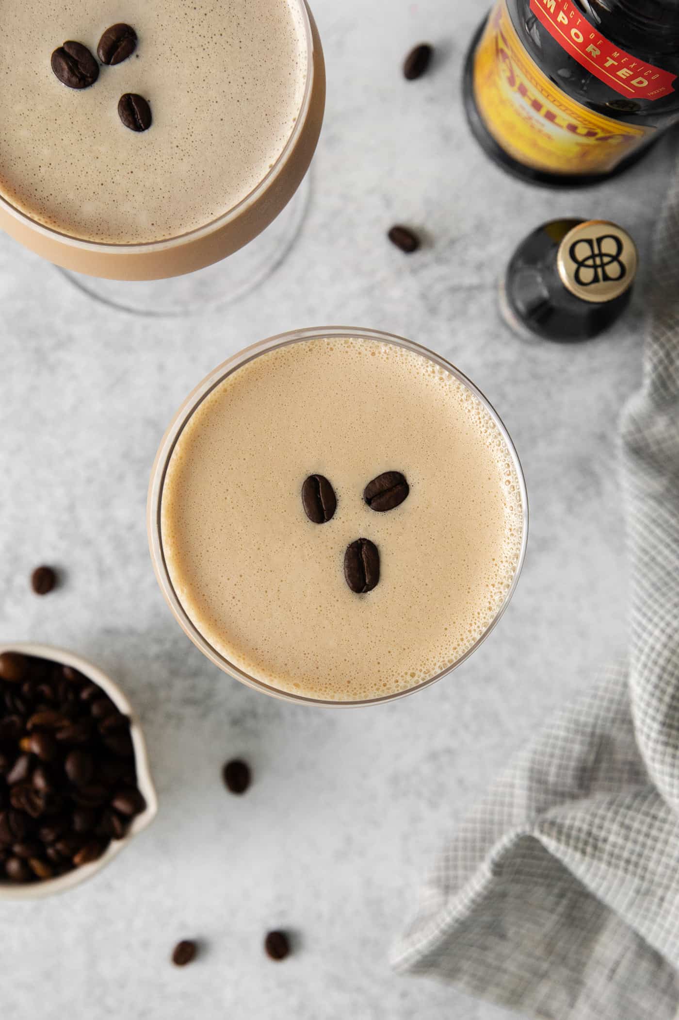 Made with espresso, vodka, and two liqueurs, this Espresso Martini is a strong coffee cocktail that's sure to provide an afternoon boost. Overhead view of an espresso martini