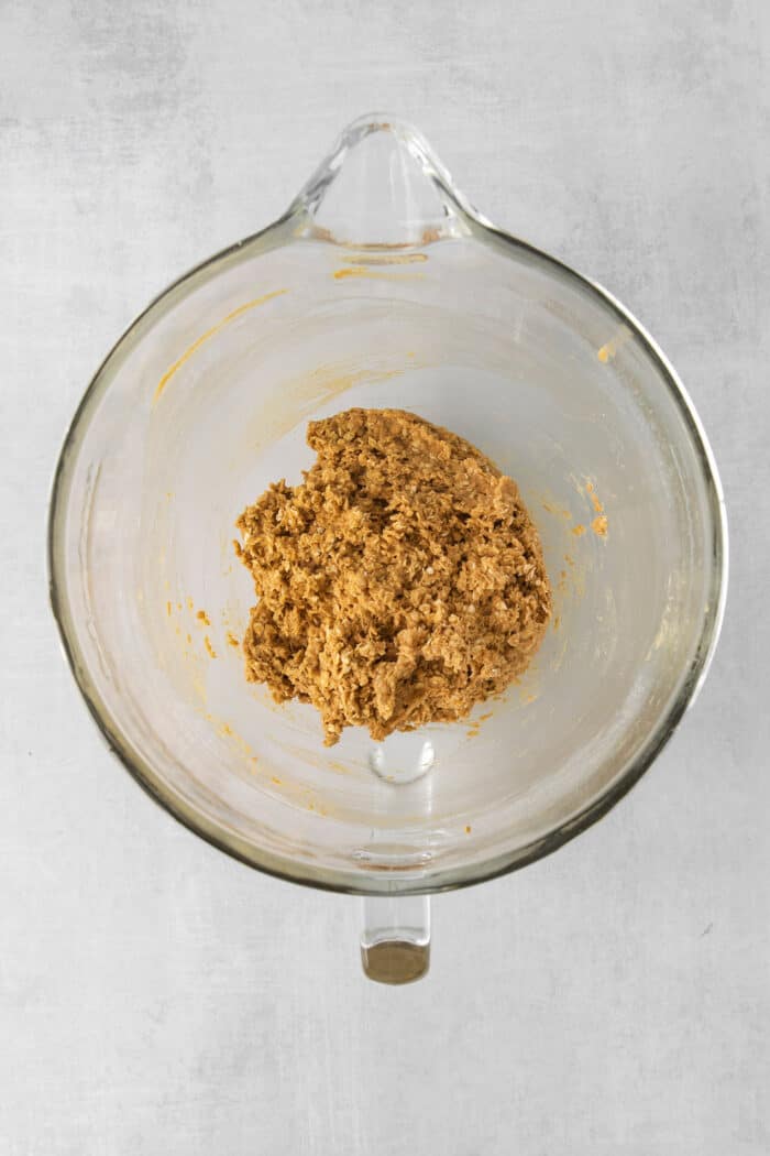 These Oatmeal Cream Pies are just like the classic store-bought variety, where a layer of sweet cream is sandwiched by chewy oatmeal cookies. Oatmeal cookie dough in a mixing bowl
