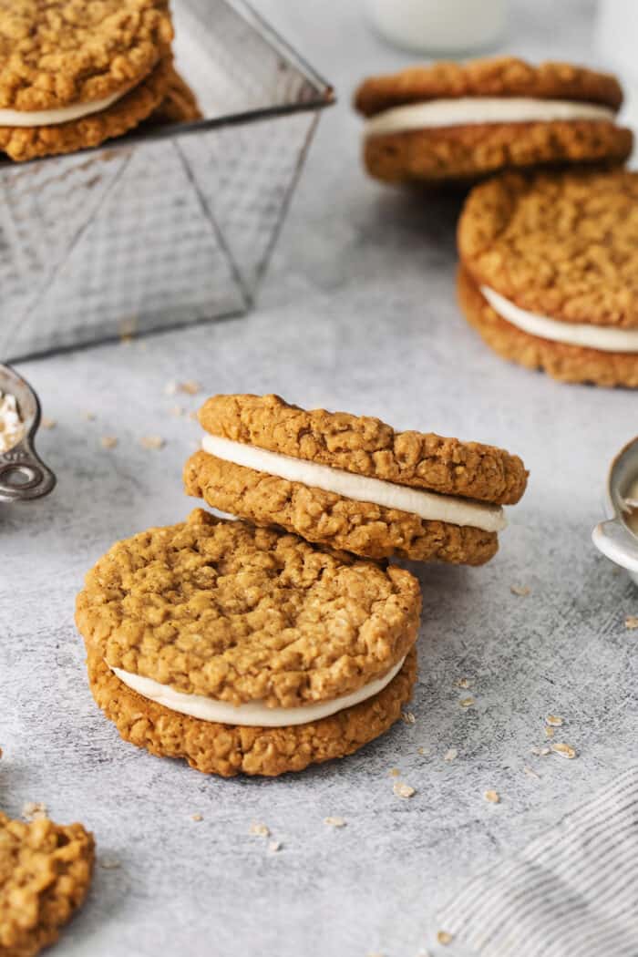 These Oatmeal Cream Pies are just like the classic store-bought variety, where a layer of sweet cream is sandwiched by chewy oatmeal cookies. Two oatmeal cream pieces next to each other
