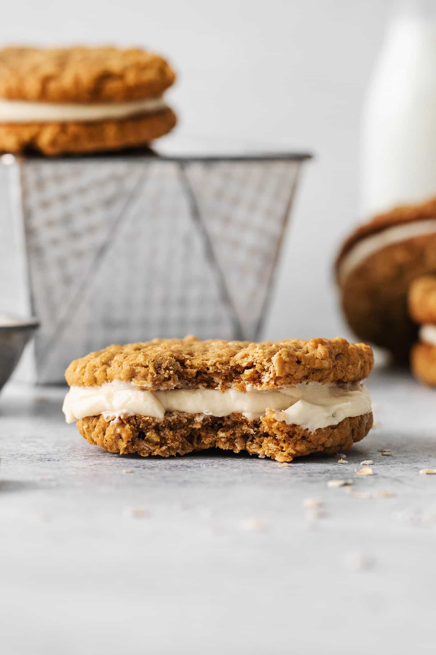 These Oatmeal Cream Pies are just like the classic store-bought variety, where a layer of sweet cream is sandwiched by chewy oatmeal cookies. An oatmeal creme pie with a bite missing