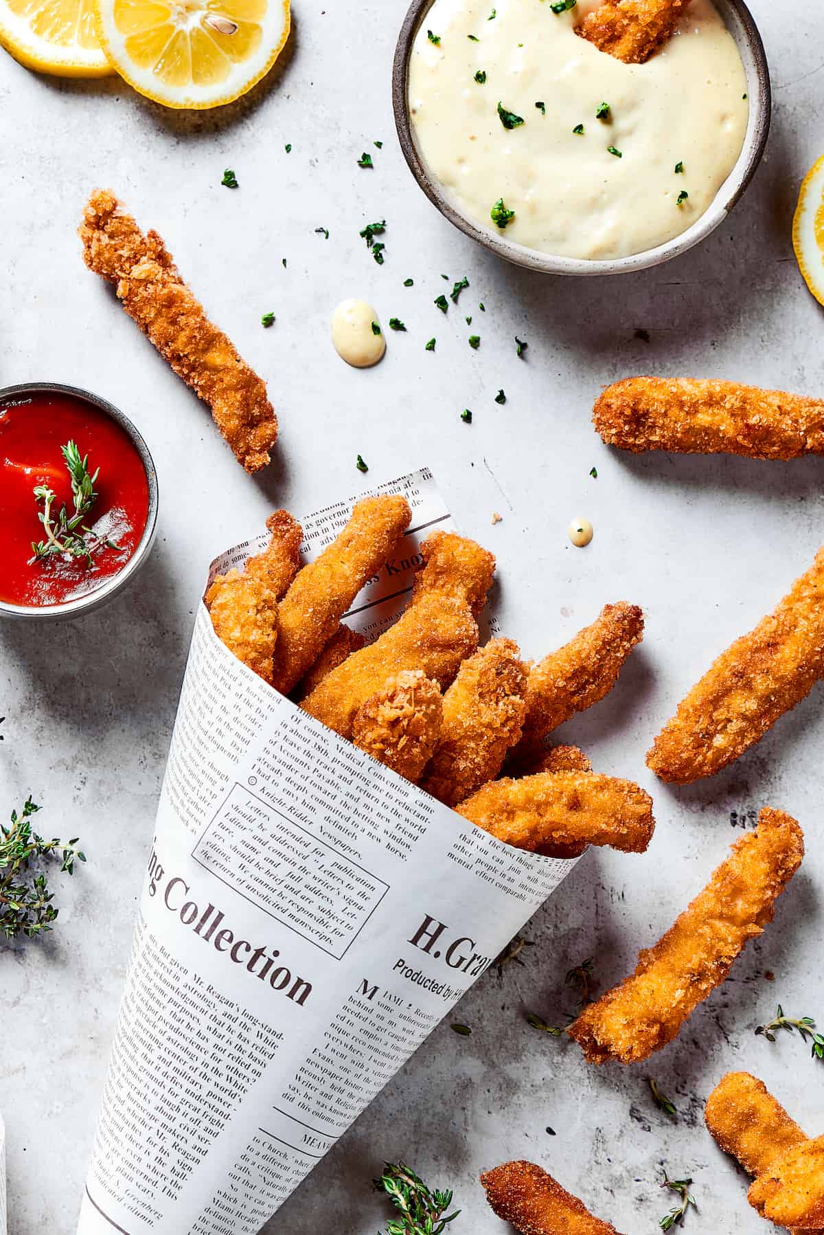 Made with thin, perfectly seasoned strips of chicken, these Chicken Fries are perfect dipped in this tangy roasted garlic aioli. A newspaper funnel of chicken fries