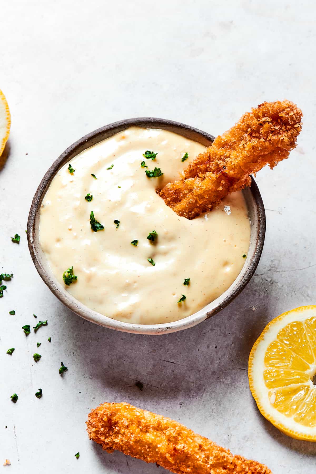Made with thin, perfectly seasoned strips of chicken, these Chicken Fries are perfect dipped in this tangy roasted garlic aioli. A chicken fry dipped in garlic aioli