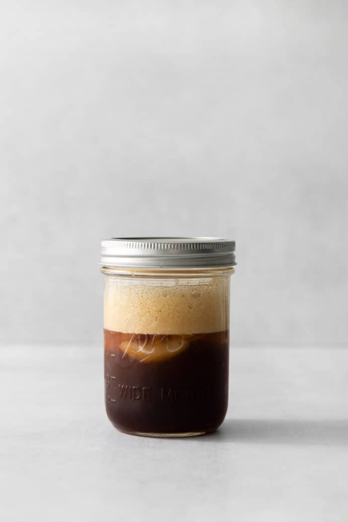 Made with just 4 ingredients, this Iced Brown Sugar Oatmilk Shaken Espresso tastes just like the Starbucks version! Shaken espresso in a pint jar