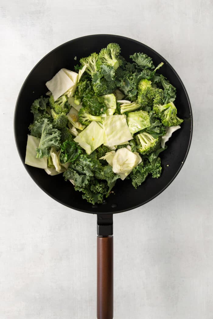Panda Express Super Greens are a fresh, bright, feel-good side dish made with broccoli, cabbage, and kale in a light garlic-ginger soy sauce. Cabbage, broccoli, and kale in a wok