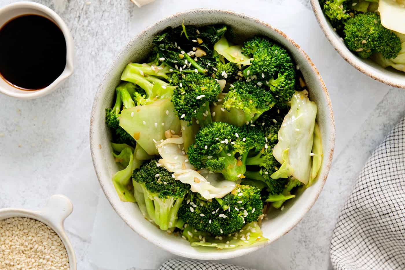 Panda Express Super Greens are a fresh, bright, feel-good side dish made with broccoli, cabbage, and kale in a light garlic-ginger soy sauce. Overhead view of a bowl of Panda Express steamed veggies