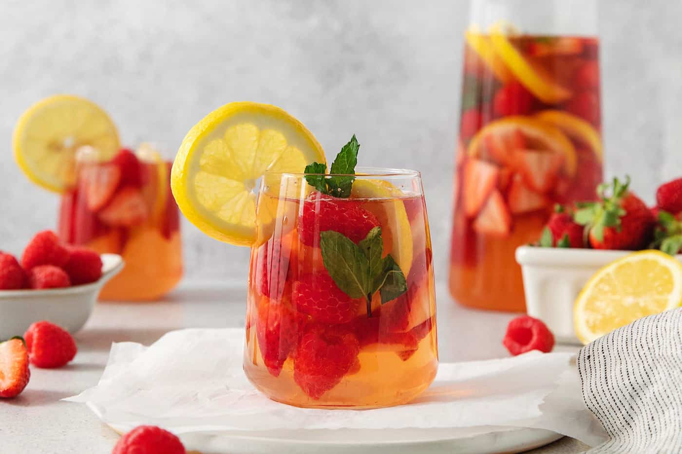 Glasses and a pitcher of sangria are shown.