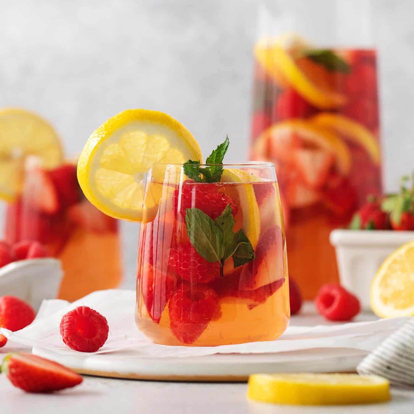 Glasses and a pitcher of sangria are shown.