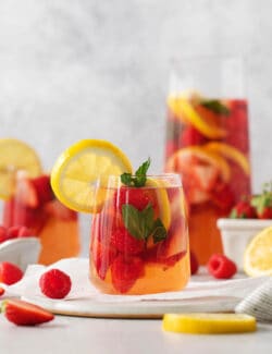 Glasses and a pitcher of sangria are shown.