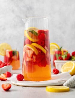A pitcher of sangria and fruit.