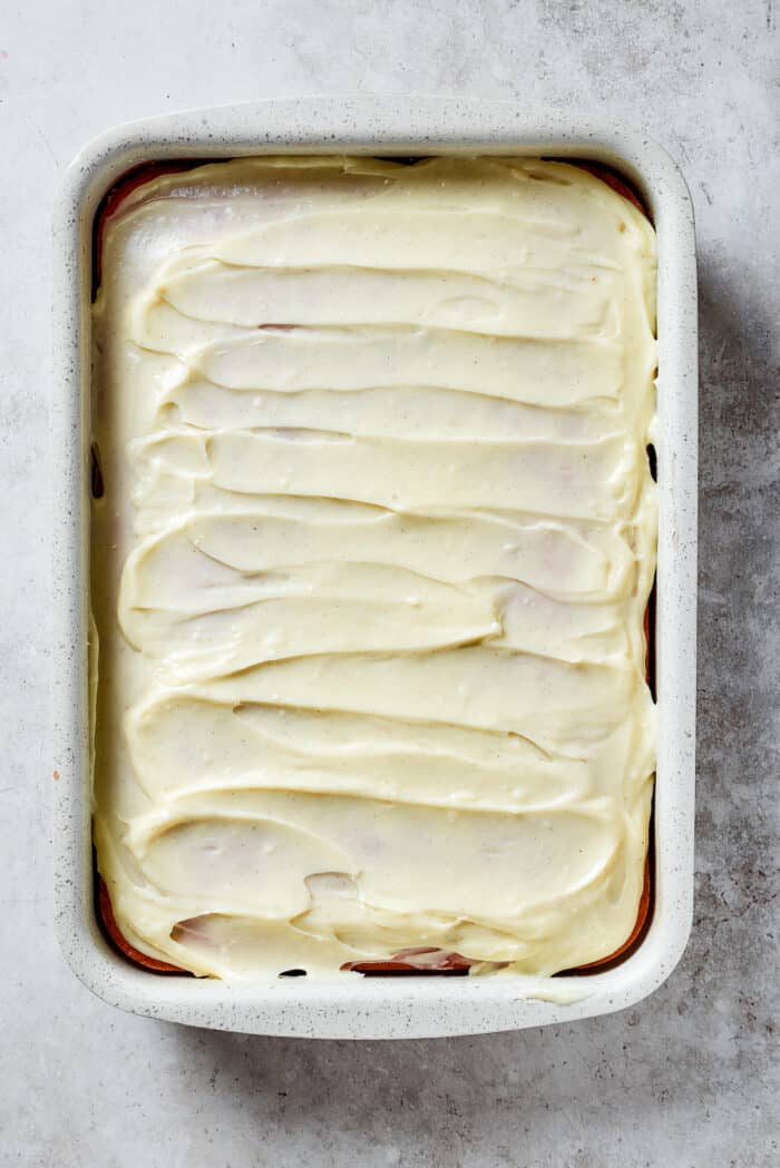 Creamy and sweet with a bit of crunch, Strawberry Crunch Cake is bursting with fruit flavor! This bright strawberry dessert is a favorite. Strawberry crunch cake is topped with cream cheese filling.