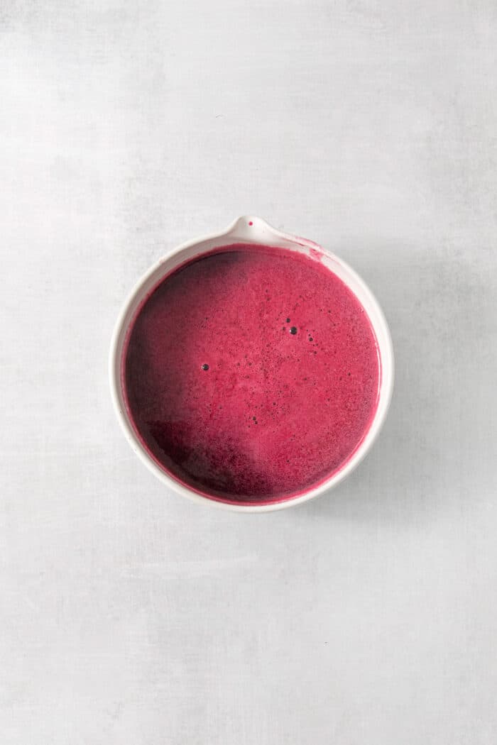 This Blueberry Lemonade is the perfect summertime drink! It’s fruity and refreshing with tart lemons and sweet blueberries. Blueberry syrup in a bowl