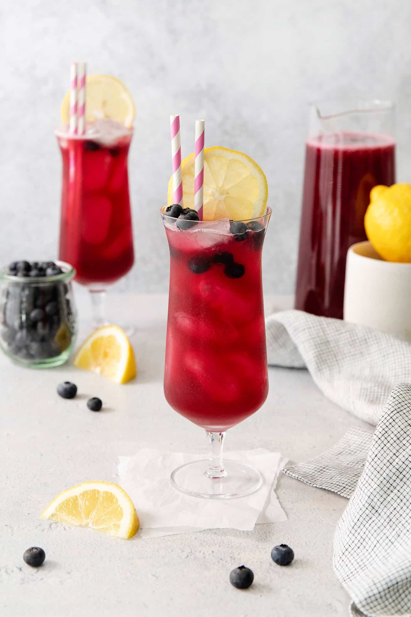 This Blueberry Lemonade is the perfect summertime drink! It’s fruity and refreshing with tart lemons and sweet blueberries. Two glasses of blueberry lemonade