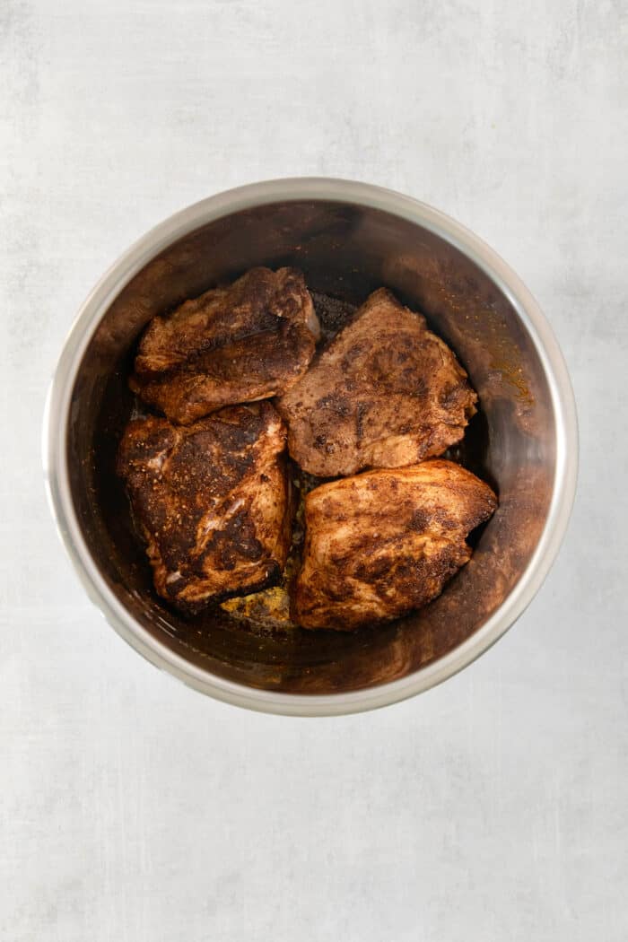 Incredibly tender and a little bit spicy, this easy Pulled Pork recipe is an absolute keeper. It's also super flavorful and versatile. Pork cooks in an Instant Pot.