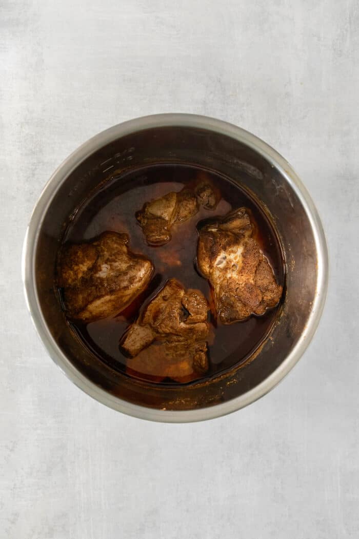 Incredibly tender and a little bit spicy, this easy Pulled Pork recipe is an absolute keeper. It's also super flavorful and versatile. Pork cooks in an Instant Pot.