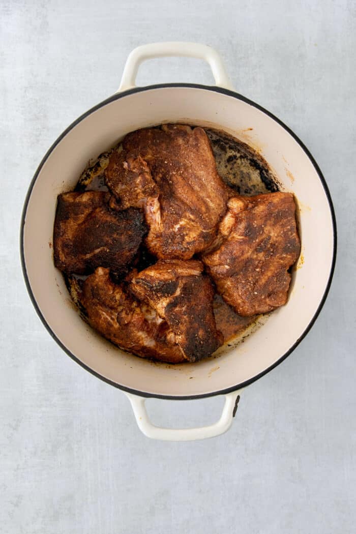 Incredibly tender and a little bit spicy, this easy Pulled Pork recipe is an absolute keeper. It's also super flavorful and versatile. Cooked pork in a dutch oven.