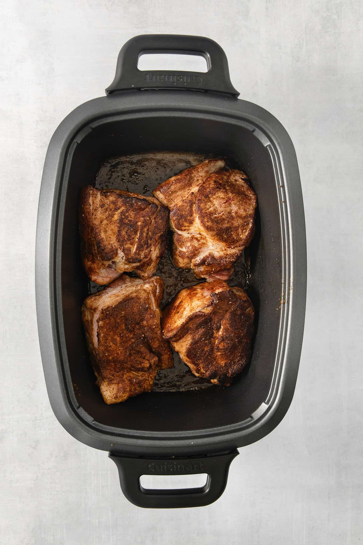Incredibly tender and a little bit spicy, this easy Pulled Pork recipe is an absolute keeper. It's also super flavorful and versatile. Pork cooks in a slow cooker.