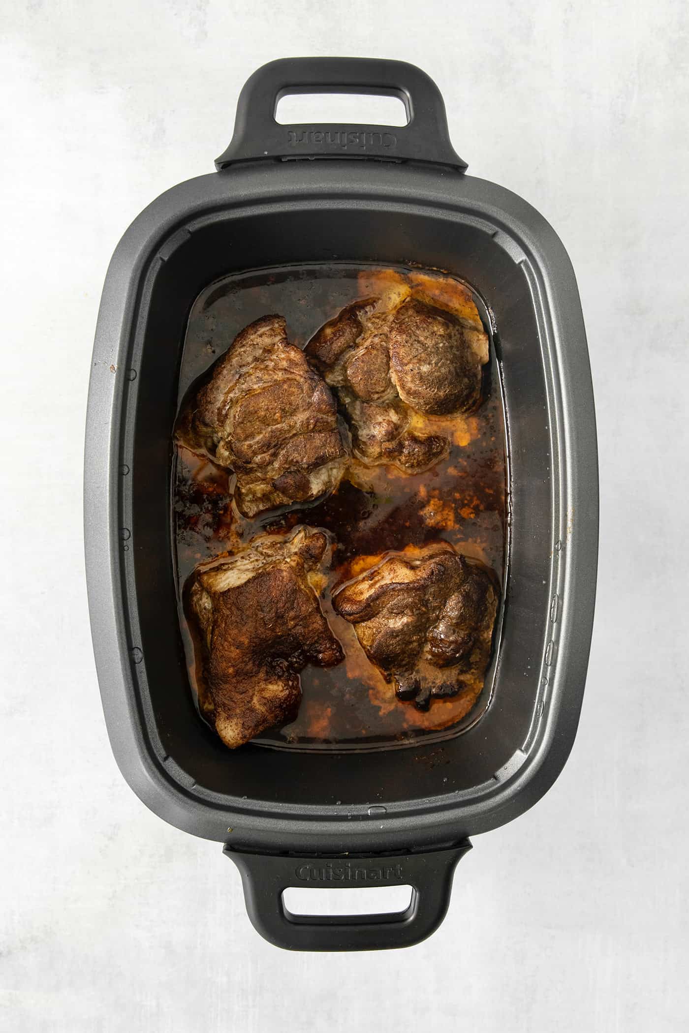 Incredibly tender and a little bit spicy, this easy Pulled Pork recipe is an absolute keeper. It's also super flavorful and versatile. Pork cooks in a slow cooker.