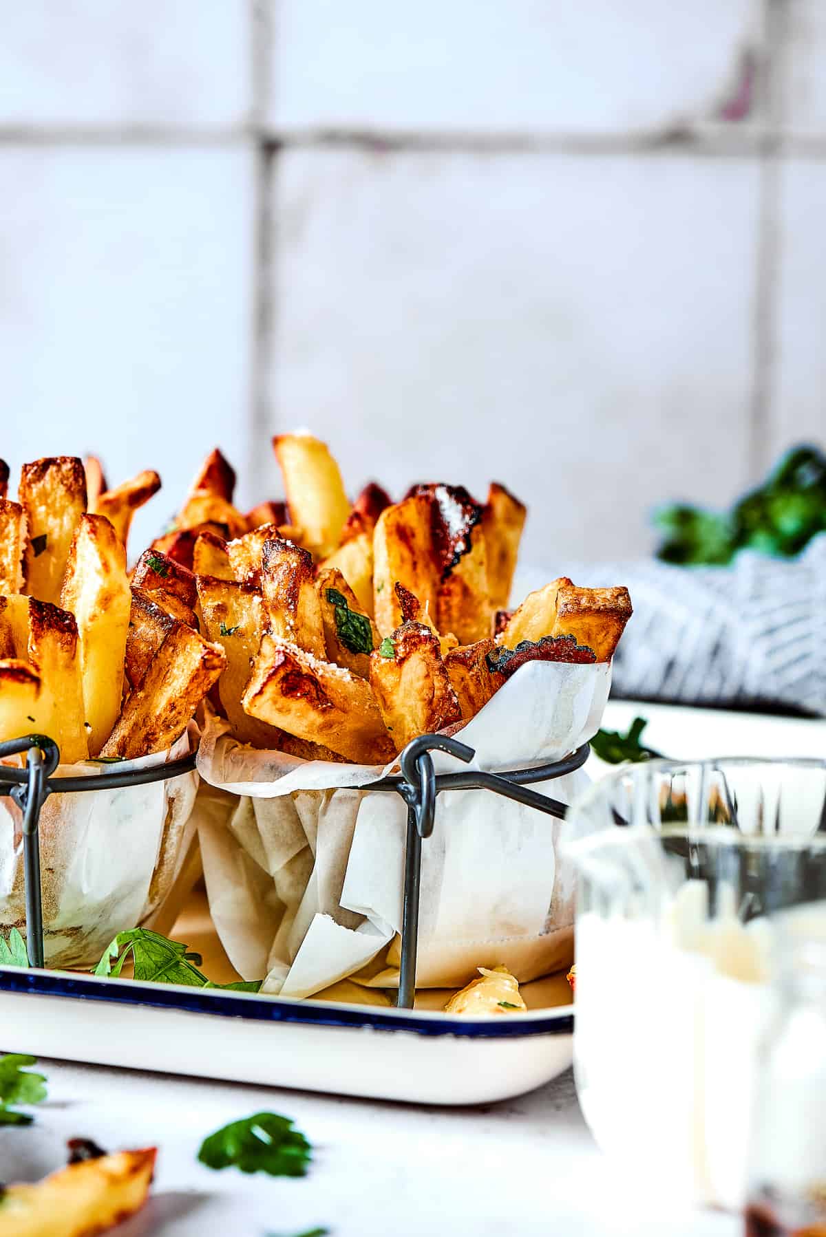 Crispy and flavorful, Truffle Fries may become your new favorite fry! They're touched with truffle salt and a dusting of parmesan cheese. Truffles fries in paper with dip.