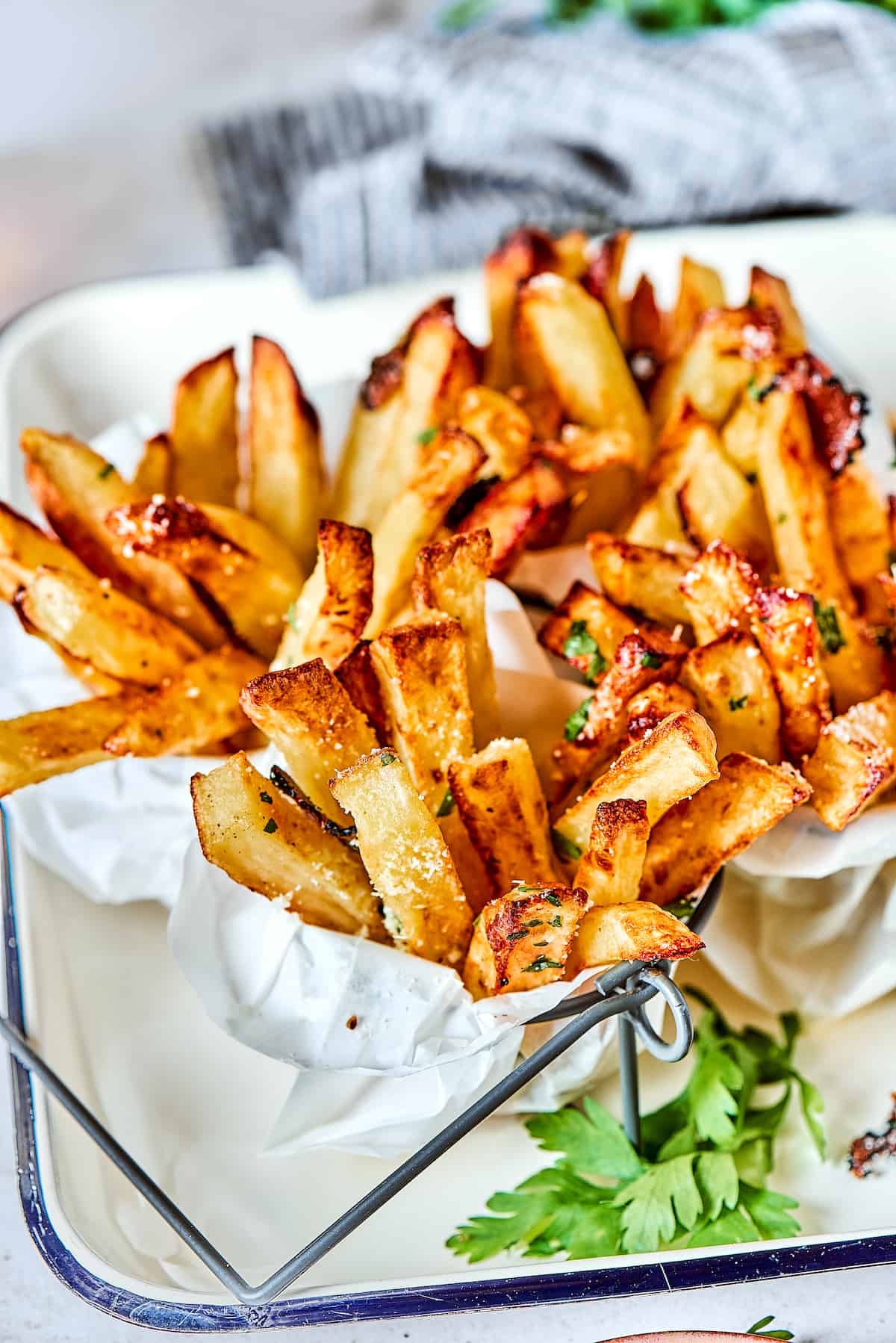 Crispy and flavorful, Truffle Fries may become your new favorite fry! They're touched with truffle salt and a dusting of parmesan cheese. Truffles fries in paper with dip.