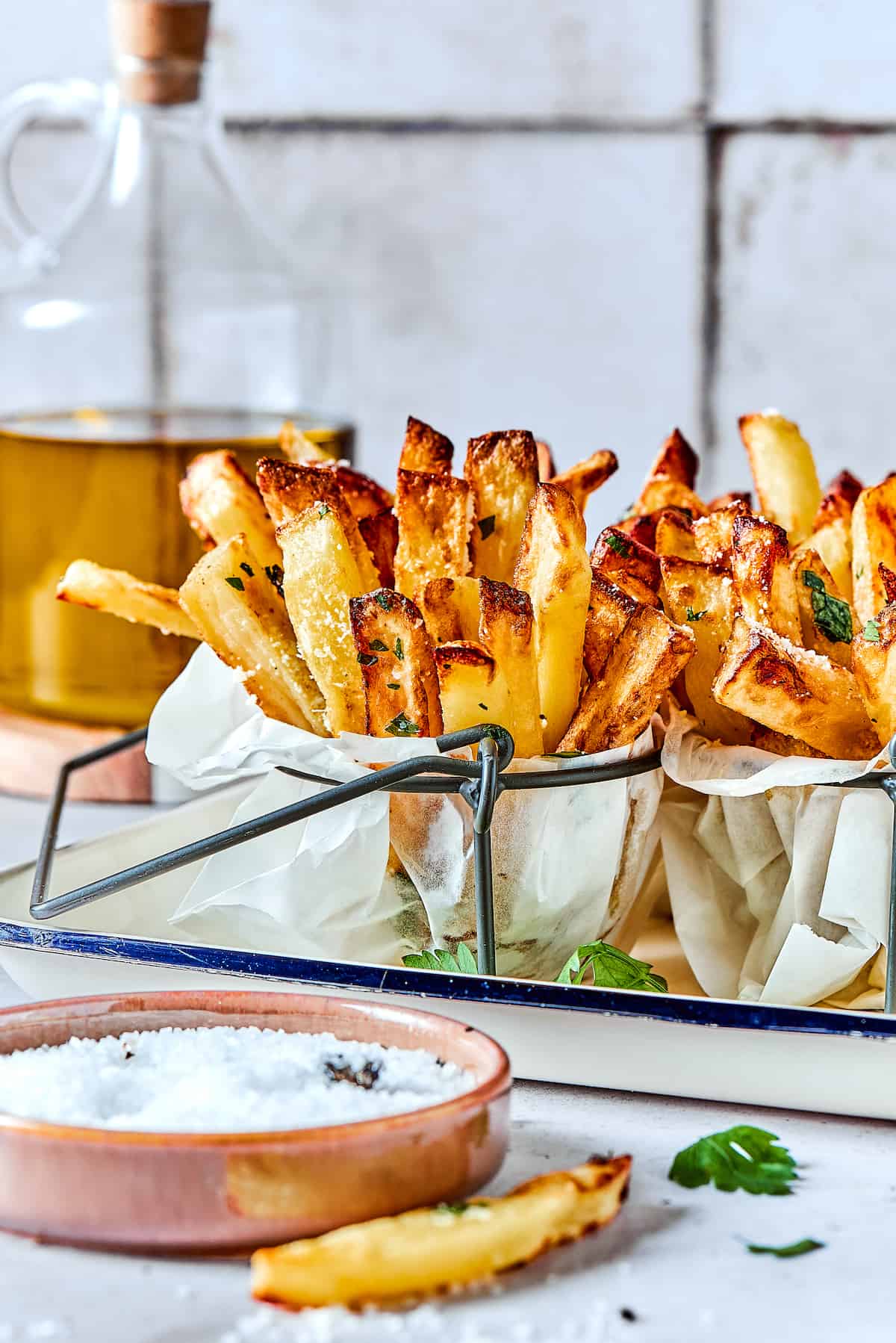 Crispy and flavorful, Truffle Fries may become your new favorite fry! They're touched with truffle salt and a dusting of parmesan cheese. Truffles fries in paper with dip.