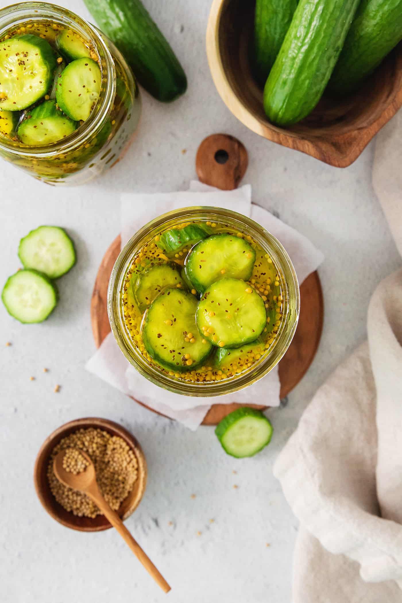 Bread and Butter Pickles are a quick and easy way to make your own pickles. This simple method is packed with flavor and crunch. Overhead shot of bread and butter pickles.