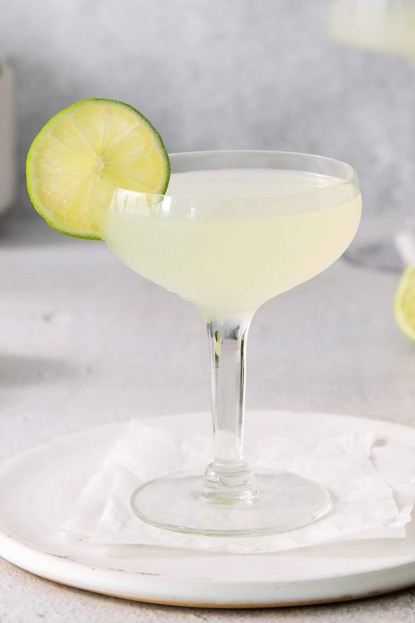 This Classic Daiquiri is an easy and refreshing cocktail you can make with just three ingredients. The perfect balance of sweet and tart! A lime daiquiri garnished with a lime slice