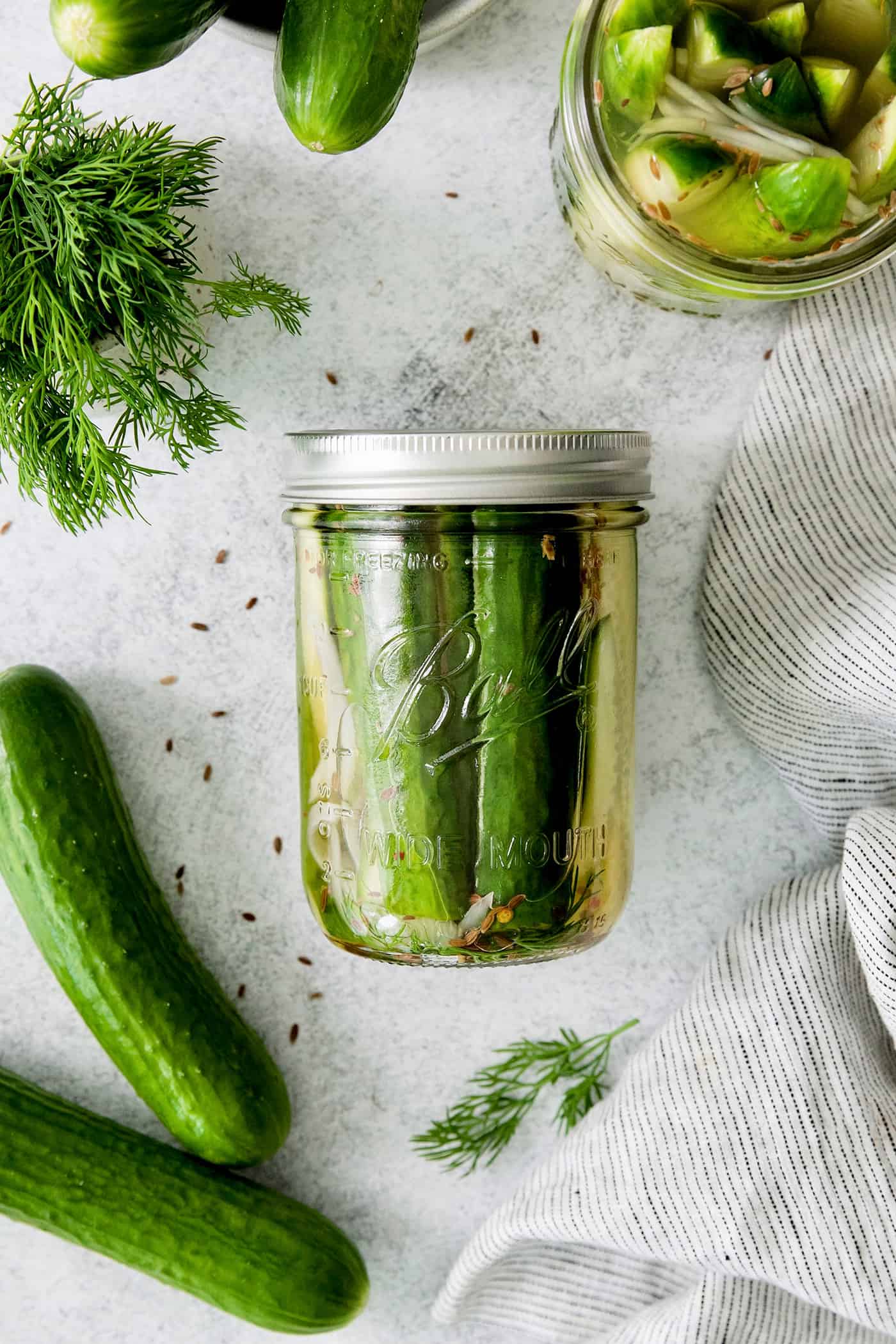These Refrigerator Dill Pickles require no canning or special equipment, just cucumbers and a simple pickling brine. An easy side or snack! Overhead view of a jar of quick refrigerator pickles
