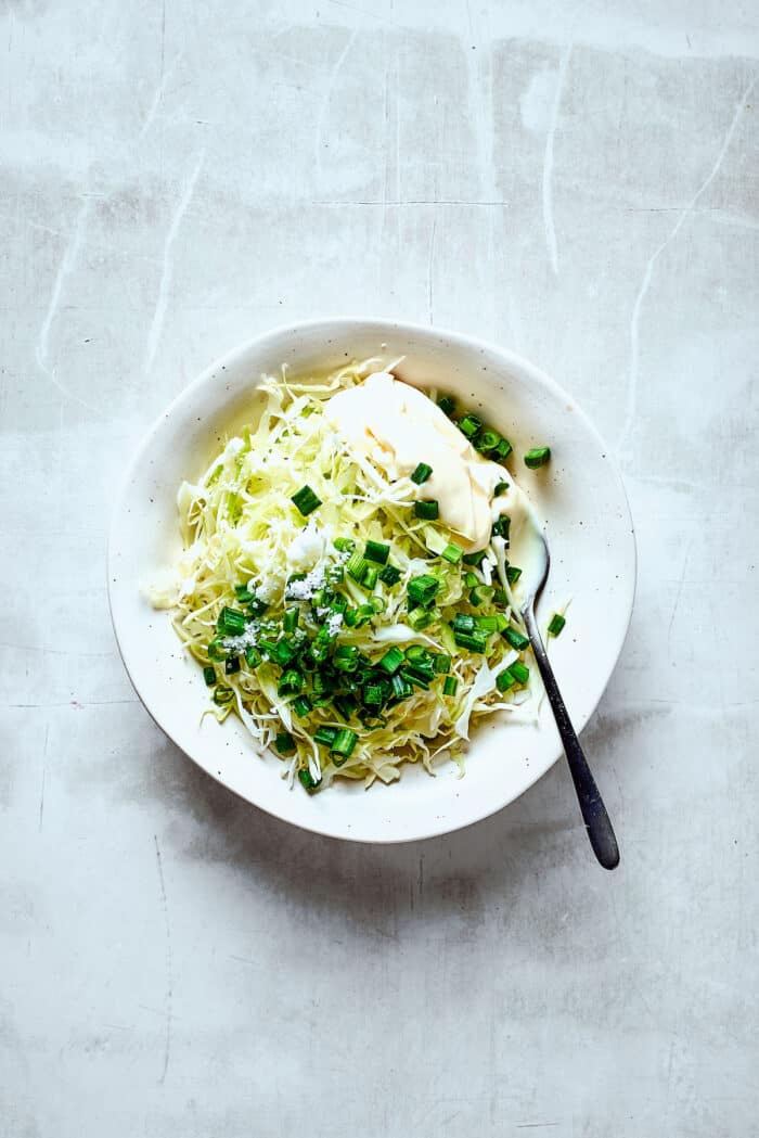 A bowl of green vegetables.