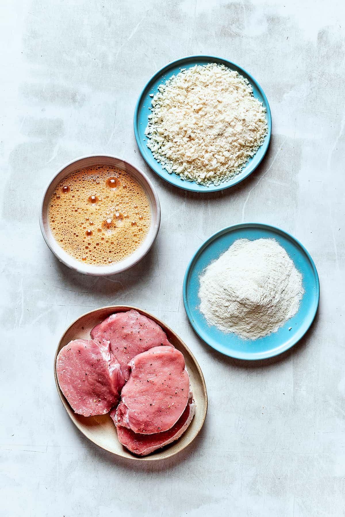 Tender, juicy Pork Katsu is always welcome on my dinner table! This Japanese dish deep fries breaded pork loin until crispy. Ingredients for pork katsu - eggs, pork, breadcrumbs, flour.