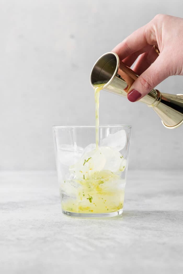 Try a Bootleg Cocktail for a citrus-infused treat of a cocktail! Lemon, lime, and orange juice combine with vodka and mint. A fruit juice medley is poured into a jar of ice.