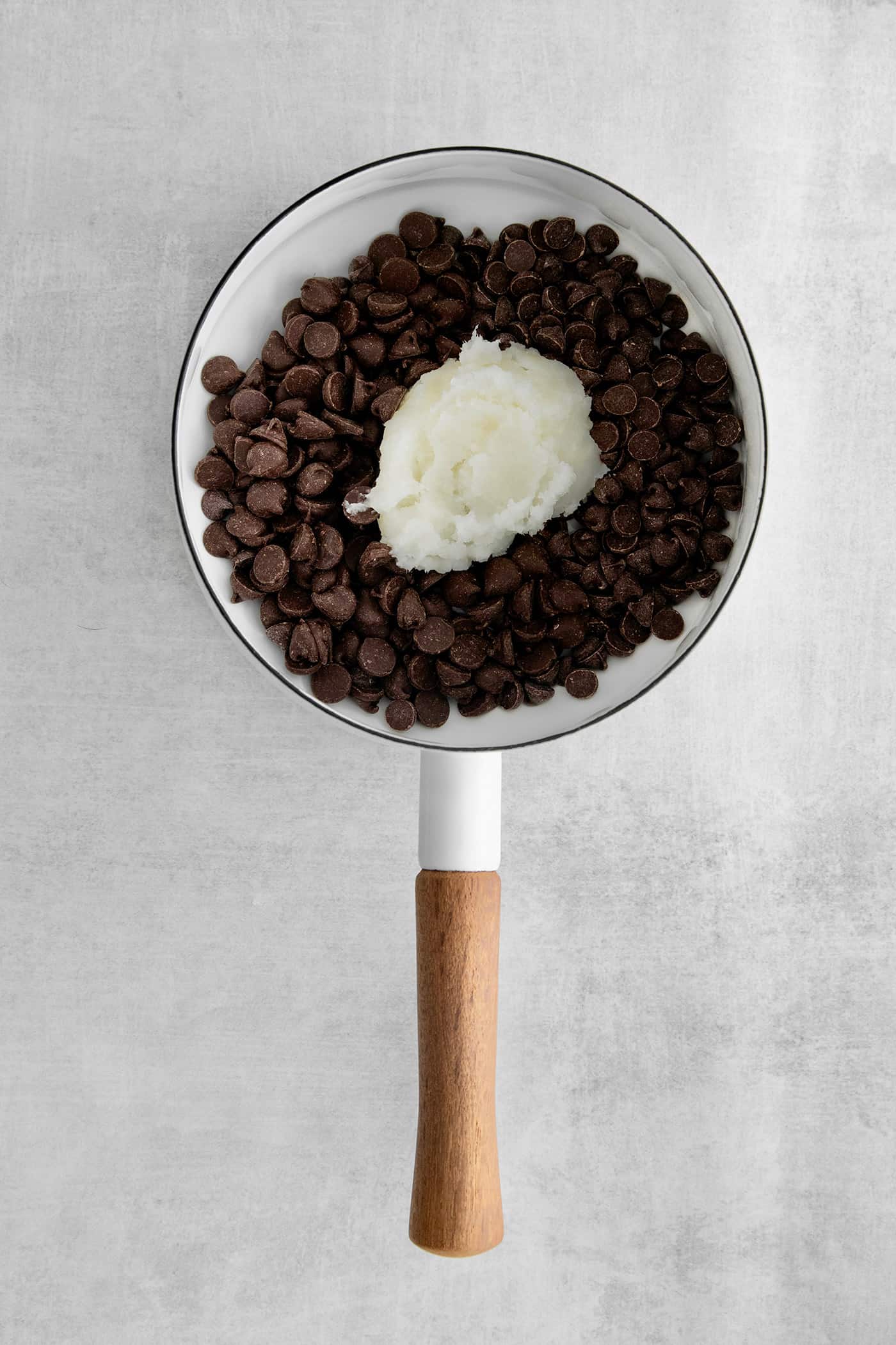 This is the easiest and best Chocolate Magic Shell recipe! Just 3 ingredients melt together to make an amazing topping. Melting chocolate and coconut oil.