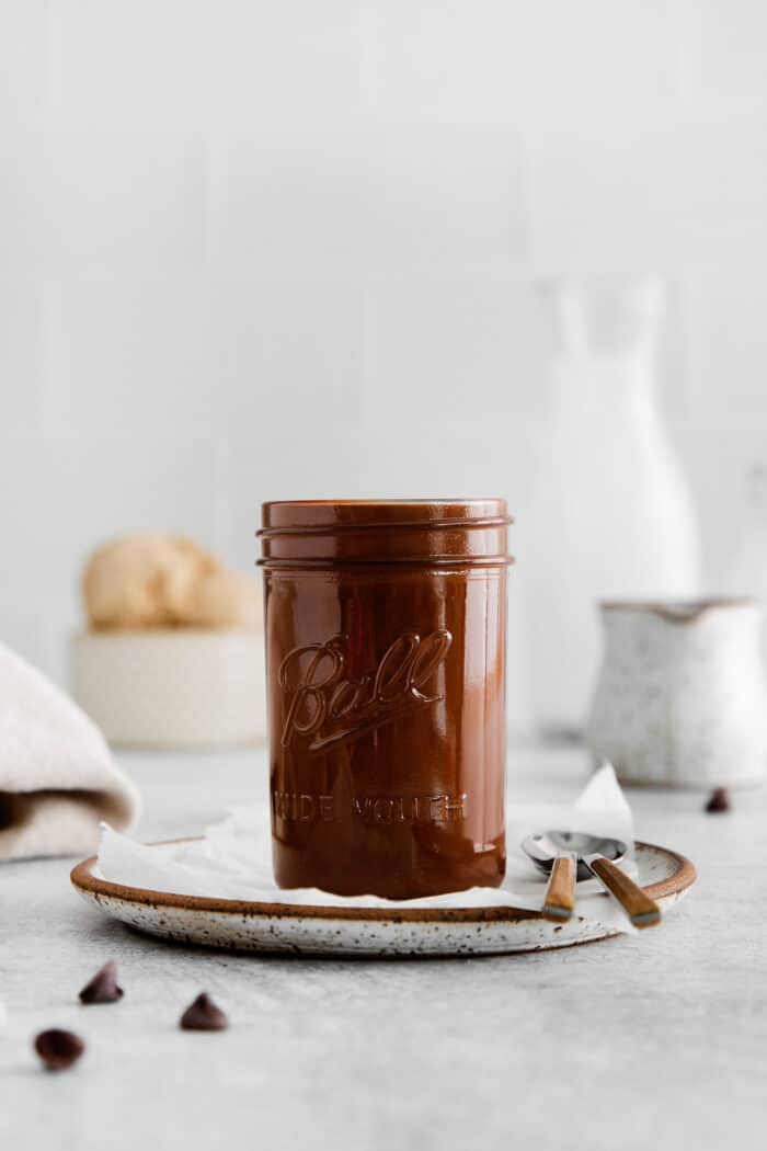 This is the easiest and best Chocolate Magic Shell recipe! Just 3 ingredients melt together to make an amazing topping. A jar of chocolate magic shell.