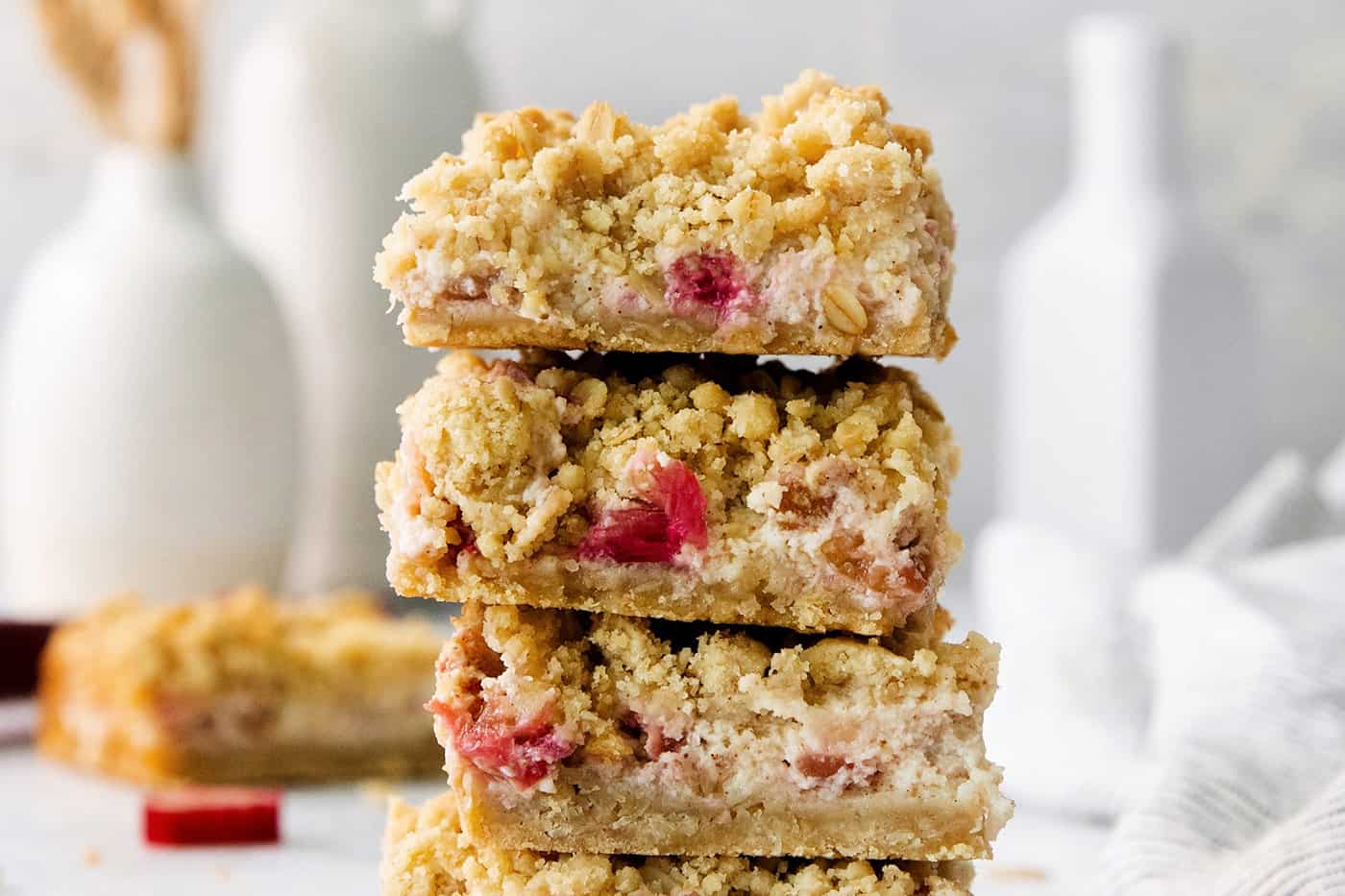 A stack of rhubarb cream cheese bars.