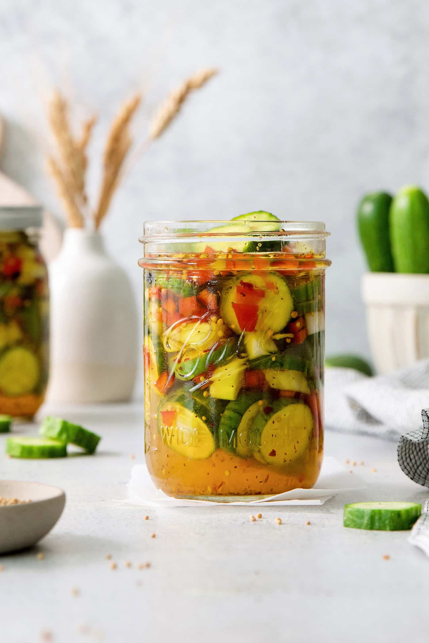 These homemade Sweet and Spicy Pickles are perfectly crisp with a bit of a bite. They're just right piled on burgers or as a snack.
