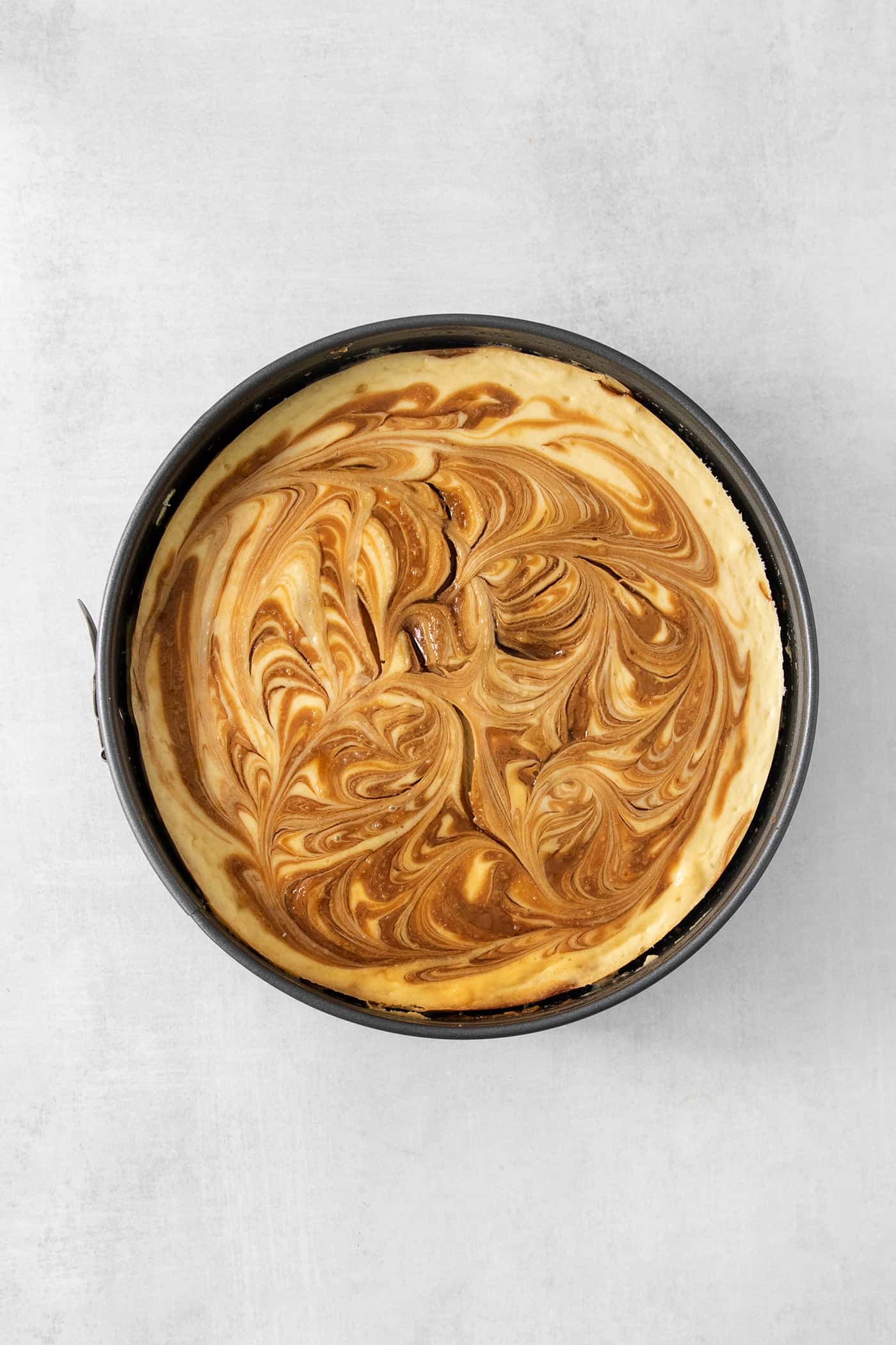 This Biscoff Cheesecake balances a rich cream cheese layer swirled with Biscoff cookie butter on a buttery cookie crust. Cookie butter is swirled into a cheesecake base.