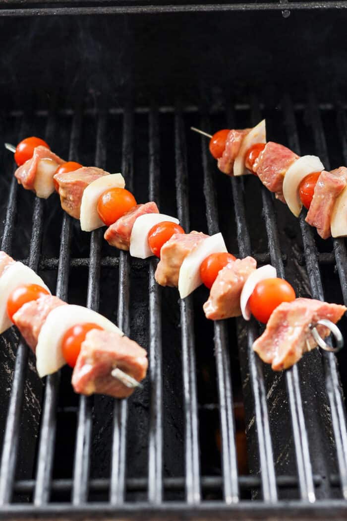 These tender Chicken Kabobs with Rapes are marinated in a lemon yogurt sauce and paired with honey balsamic shallots and sweet juicy grapes. Skewers of honey mustard beef kabobs with vegetables are shown cooking on a grill.