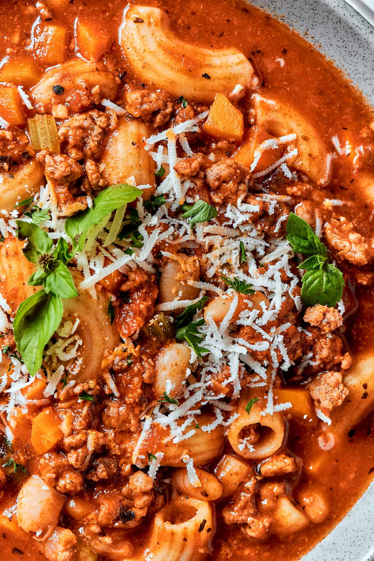 Easy, Italian-inspired Pasta Fazool is a wonderful soup that pairs creamy white beans with ground meat and pasta in a tomato-based broth. A close up shot of pasta fazool.
