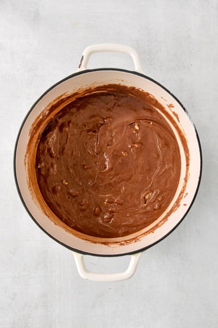 Fantasy Fudge is a thick, rich, no-fail chocolatey fudge made with semi-sweet chocolate, marshmallow creme, and walnuts. A top down shot of Fantasy Fudge mix.