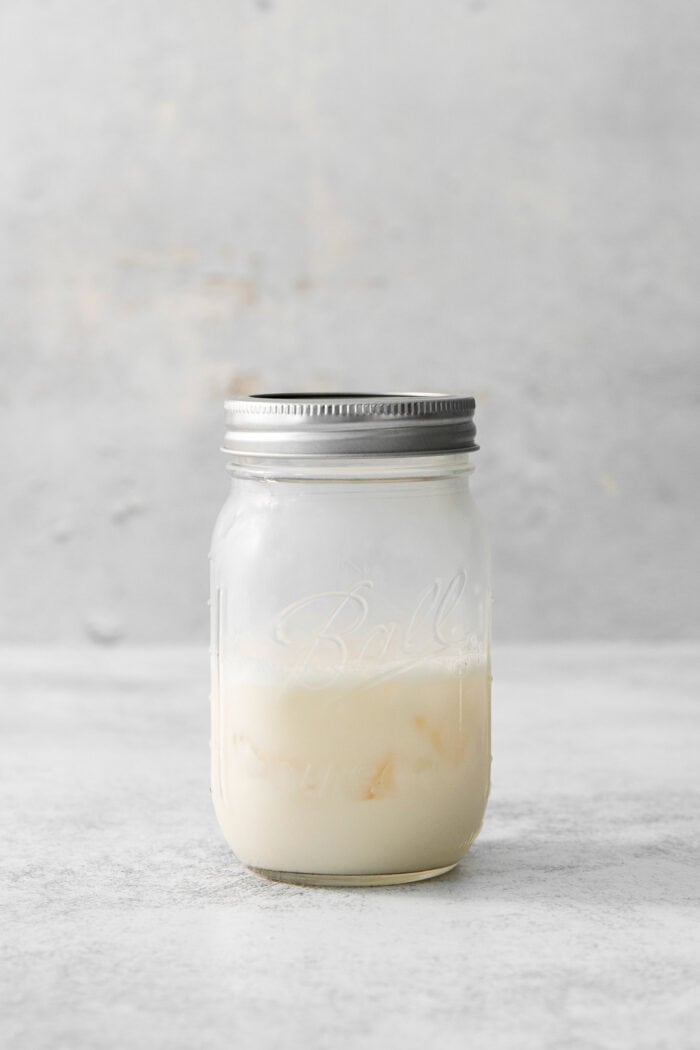 This Salted Nut Roll Shot is a fantastic twist on the salted nut roll candy bar with Rumchata, peanut butter whiskey, and vanilla vodka. A mason jar holds the mix for salted nut roll shots.