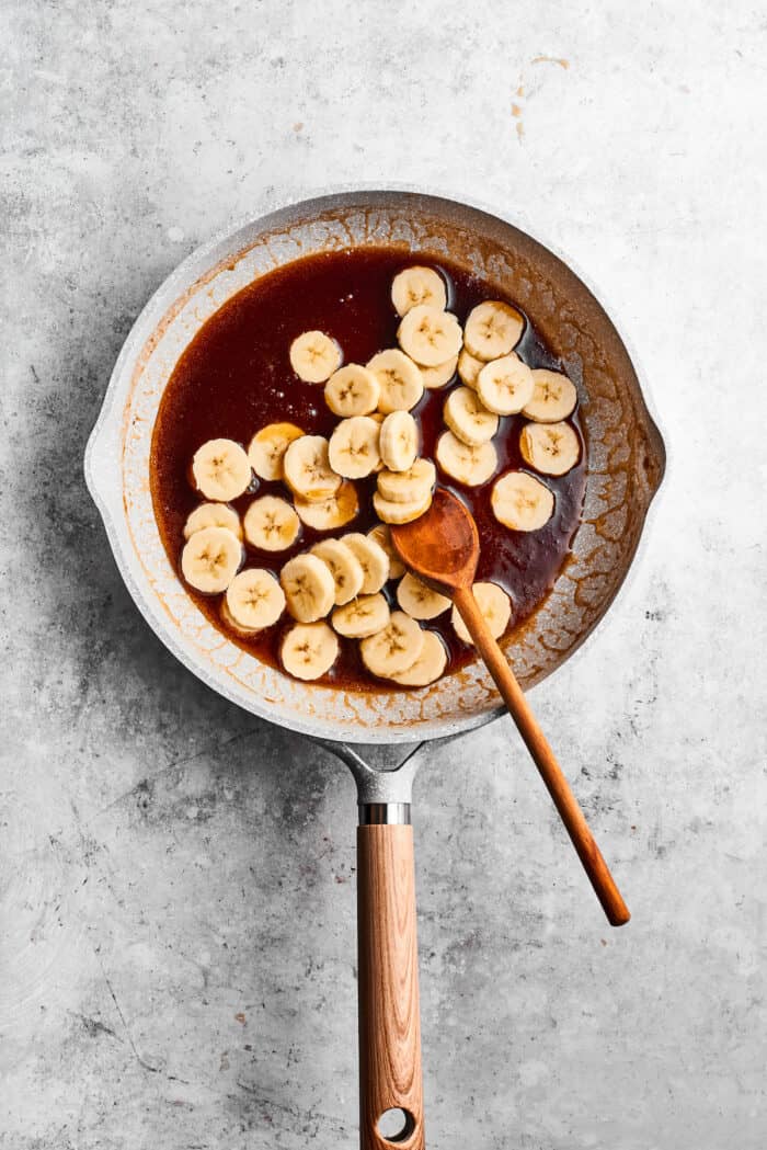 Bananas Foster French Toast features rich and tender slices of egg-soaked sweet bread that are topped with rum-spiked caramelized bananas. Banana slices cook in a mix of melted butter, maple syrup, rum, and spices in a skillet.