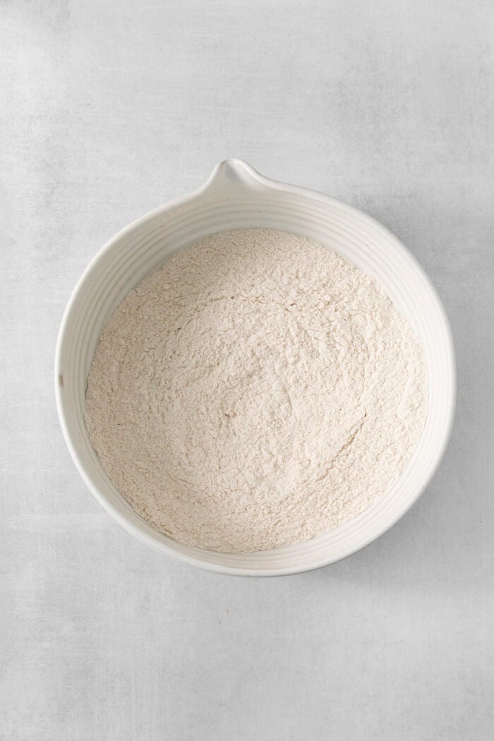 rotein-packed Cottage Cheese Pancakes are light and fluffy, flavored with cinnamon and vanilla, and rich and creamy from cottage cheese. The dry mix for cottage cheese pancakes is shown in a white bowl.