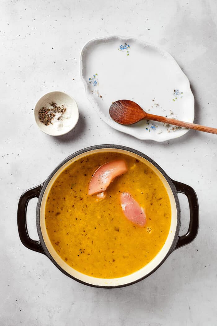 Greek-inspired Lemon Chicken Orzo Soup is fragrant with garlic and packed with tender chicken, vegetables, and delicate orzo pasta. Chicken breasts are added to the broth and vegetable mixture.